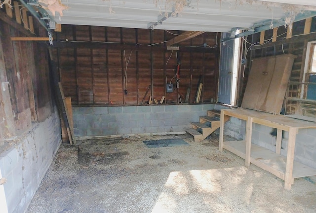 garage with concrete block wall