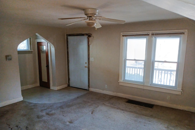 interior space with visible vents, baseboards, and a ceiling fan