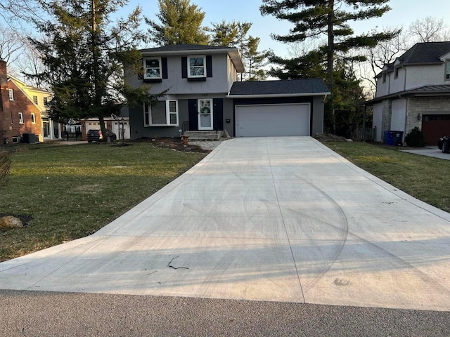 traditional-style home with a front lawn, an attached garage, and concrete driveway