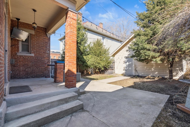 view of patio / terrace with central AC and fence