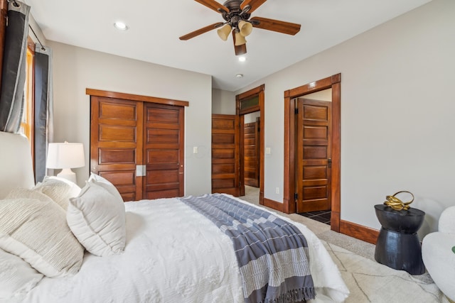 carpeted bedroom with a closet, recessed lighting, baseboards, and ceiling fan