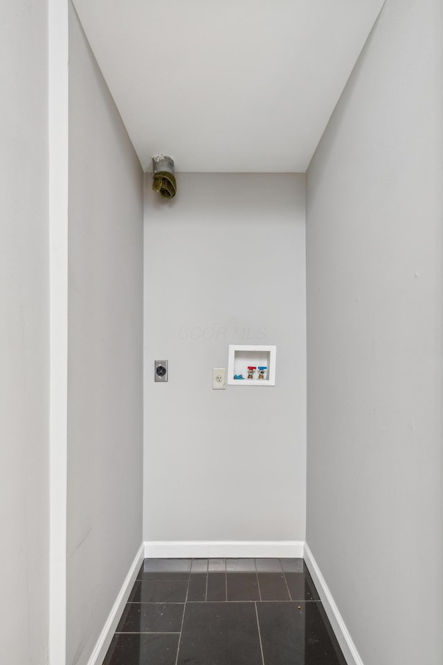 washroom featuring laundry area, hookup for a washing machine, baseboards, and hookup for an electric dryer