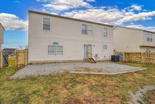 back of property featuring a lawn, entry steps, a patio, and fence