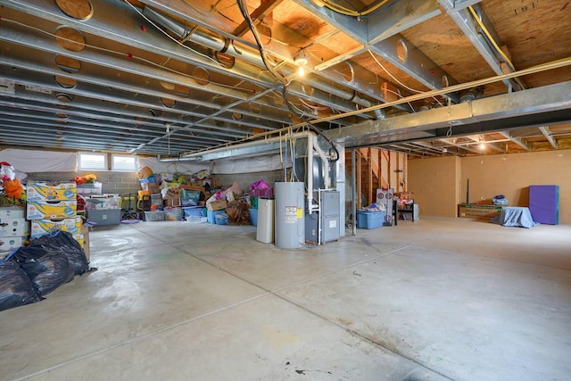 basement with heating unit and electric water heater