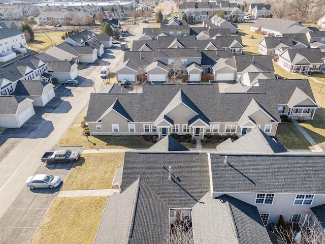 birds eye view of property with a residential view