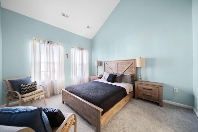 carpeted bedroom featuring baseboards, visible vents, and high vaulted ceiling