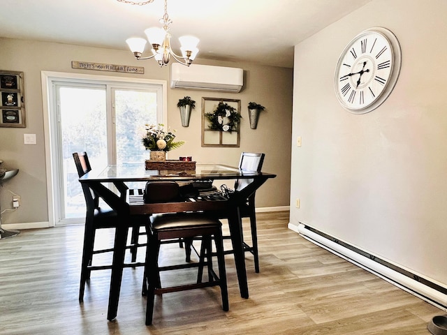 dining area with a notable chandelier, an AC wall unit, light wood finished floors, baseboards, and baseboard heating