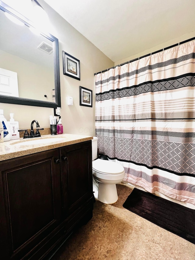 full bathroom with visible vents, curtained shower, toilet, and vanity