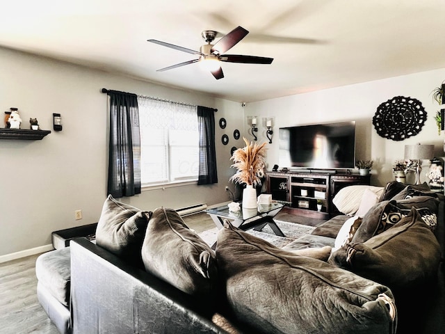 living room with baseboards, a baseboard heating unit, a ceiling fan, and wood finished floors