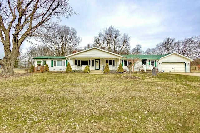 single story home featuring a porch, a front yard, a chimney, a garage, and driveway