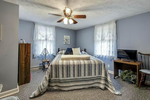 bedroom featuring carpet flooring, multiple windows, baseboards, and a baseboard radiator