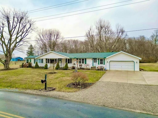 single story home with a front yard, a porch, a garage, and driveway