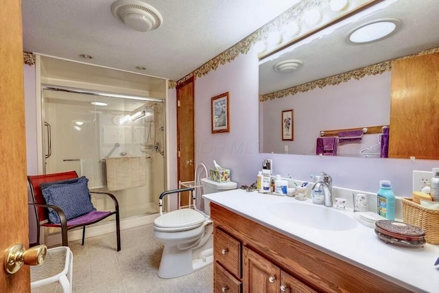 full bath with visible vents, toilet, a stall shower, and vanity