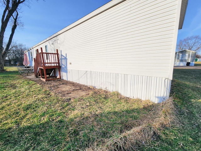 view of home's exterior featuring a lawn