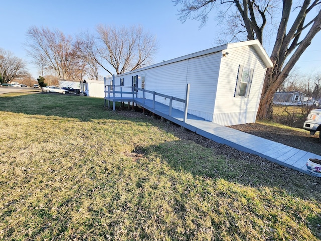 view of property exterior featuring a yard and a wooden deck