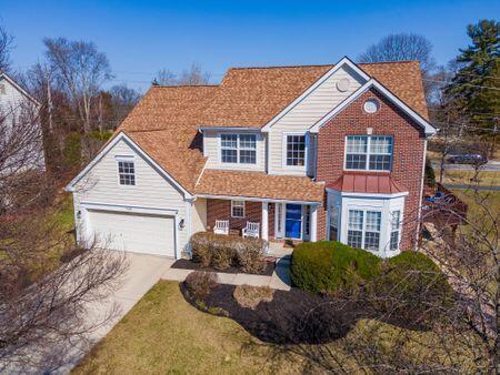 traditional home with concrete driveway and a garage