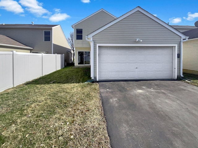 exterior space featuring aphalt driveway and fence