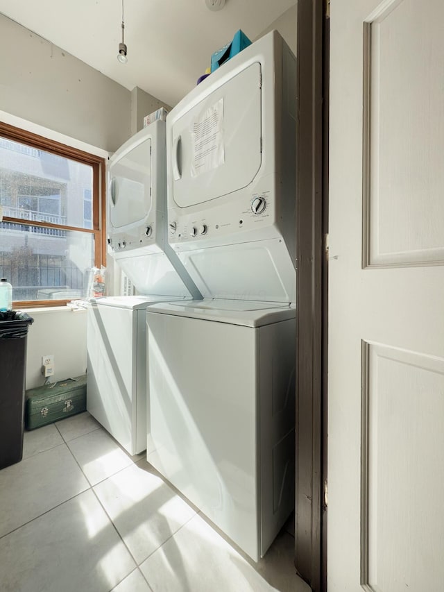 laundry room with light tile patterned floors, laundry area, and washer and dryer