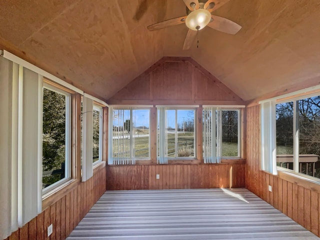 unfurnished sunroom featuring lofted ceiling and ceiling fan