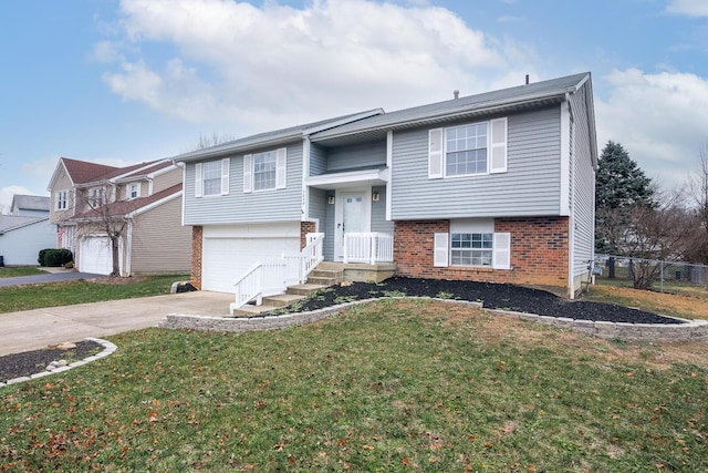 split foyer home with fence, driveway, an attached garage, a front lawn, and brick siding