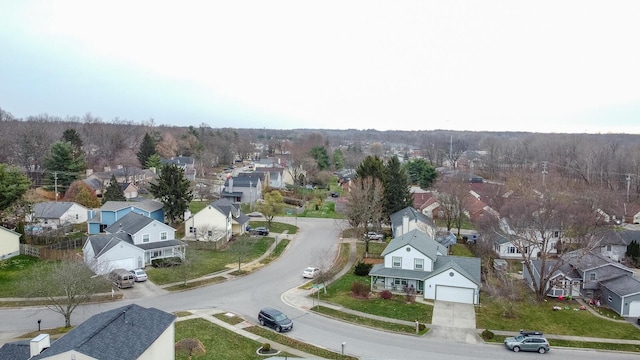 birds eye view of property with a residential view