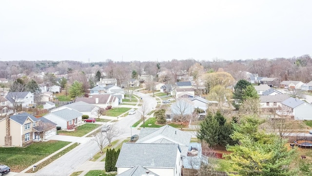 birds eye view of property with a residential view