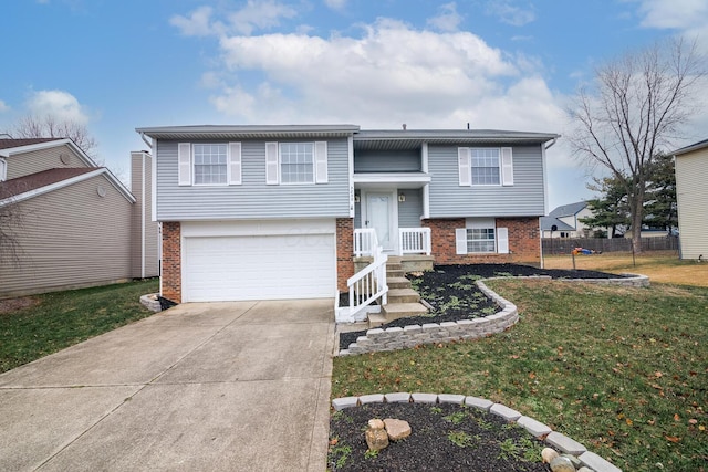 raised ranch featuring brick siding, concrete driveway, a front yard, and fence