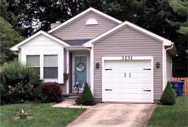 ranch-style home with a chimney, driveway, an attached garage, and a front yard