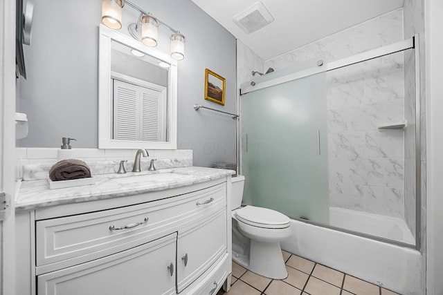 full bath featuring vanity, visible vents, enclosed tub / shower combo, tile patterned flooring, and toilet