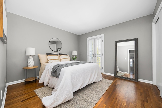 bedroom with hardwood / wood-style flooring, french doors, and baseboards