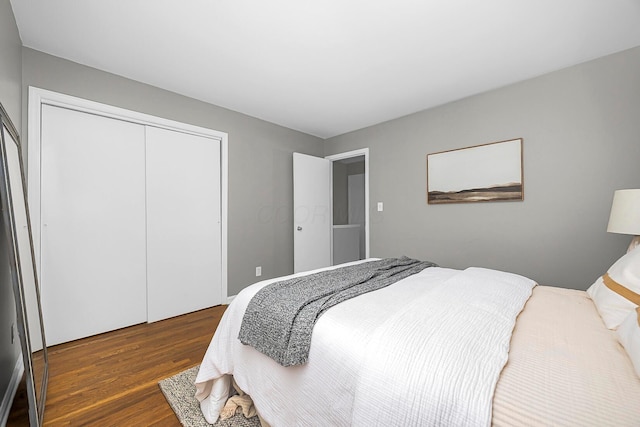 bedroom with a closet and wood finished floors