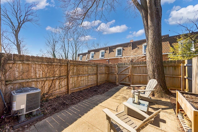 view of patio featuring cooling unit and a fenced backyard