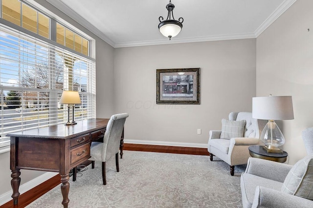 office area featuring crown molding, baseboards, and wood finished floors