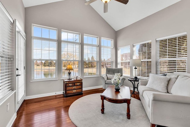 living area featuring hardwood / wood-style floors, plenty of natural light, and baseboards