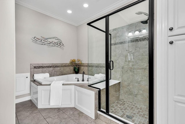 bathroom featuring a stall shower, a bath, crown molding, and tile patterned floors