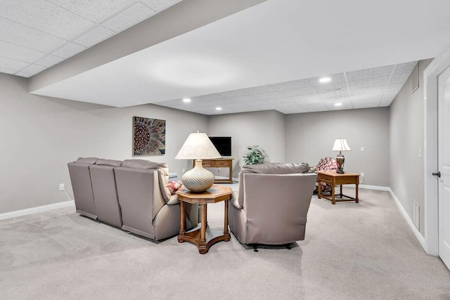 carpeted living room with recessed lighting, a paneled ceiling, baseboards, and visible vents