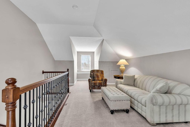 living room featuring baseboards, carpet, and vaulted ceiling