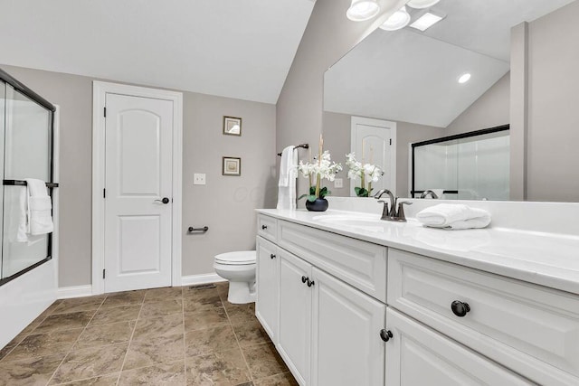 full bath featuring toilet, vanity, baseboards, and vaulted ceiling