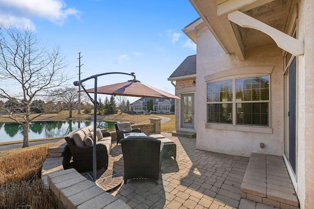 view of patio with a water view