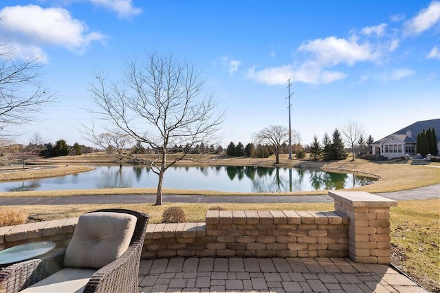 view of patio featuring a water view