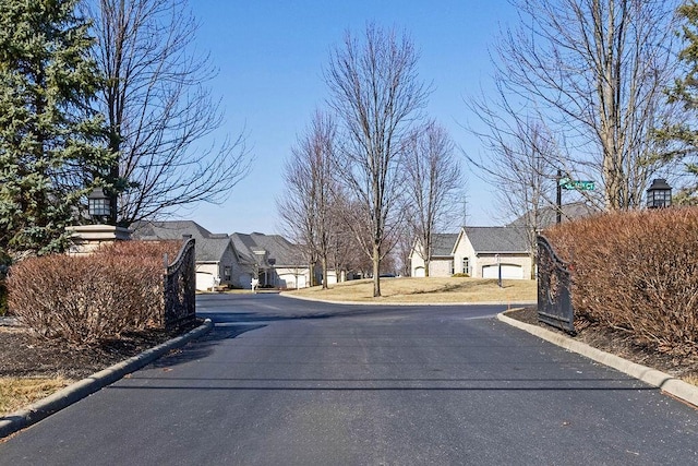 view of street with a residential view and curbs