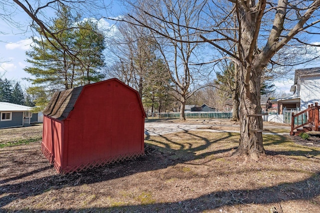 view of shed with fence