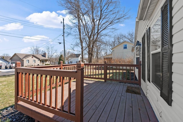 wooden deck featuring a residential view