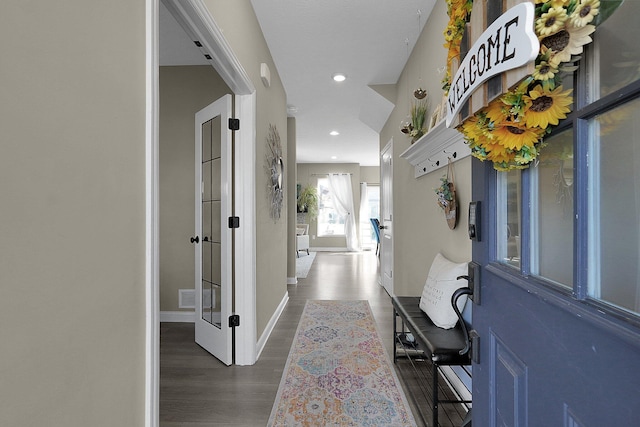 entryway featuring recessed lighting, visible vents, baseboards, and wood finished floors