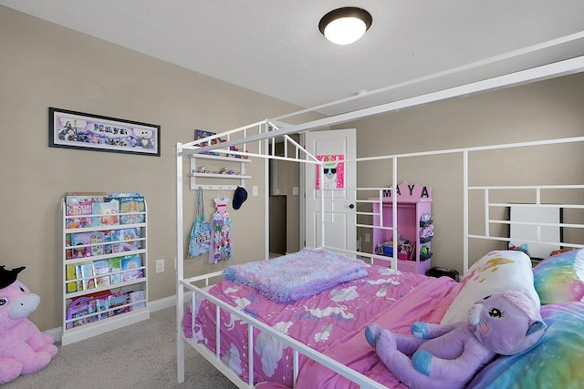 bedroom featuring baseboards and carpet