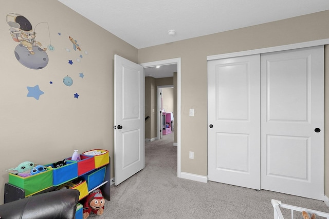 game room featuring baseboards and carpet flooring