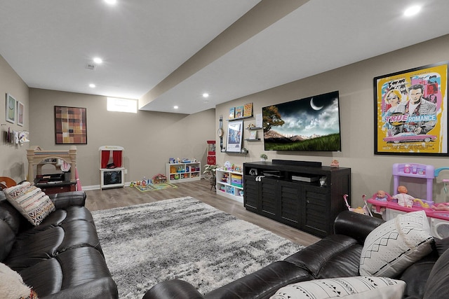 living room with recessed lighting and wood finished floors