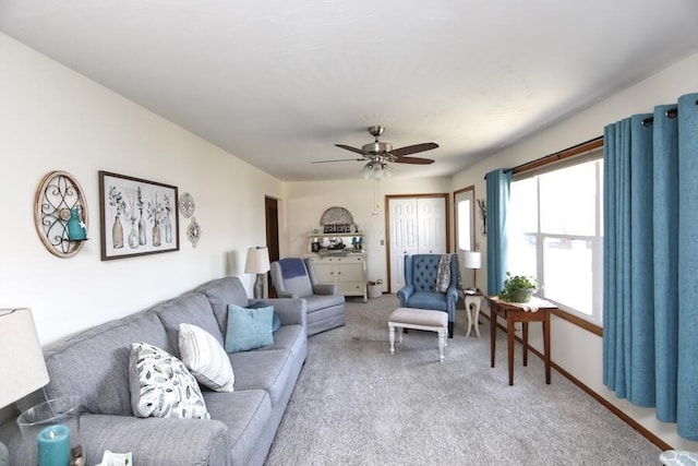 living room featuring ceiling fan and light carpet