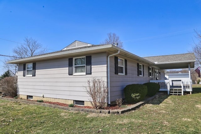 view of property exterior with covered porch and a yard