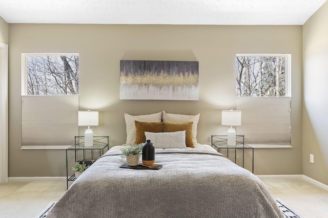 bedroom with carpet flooring and baseboards